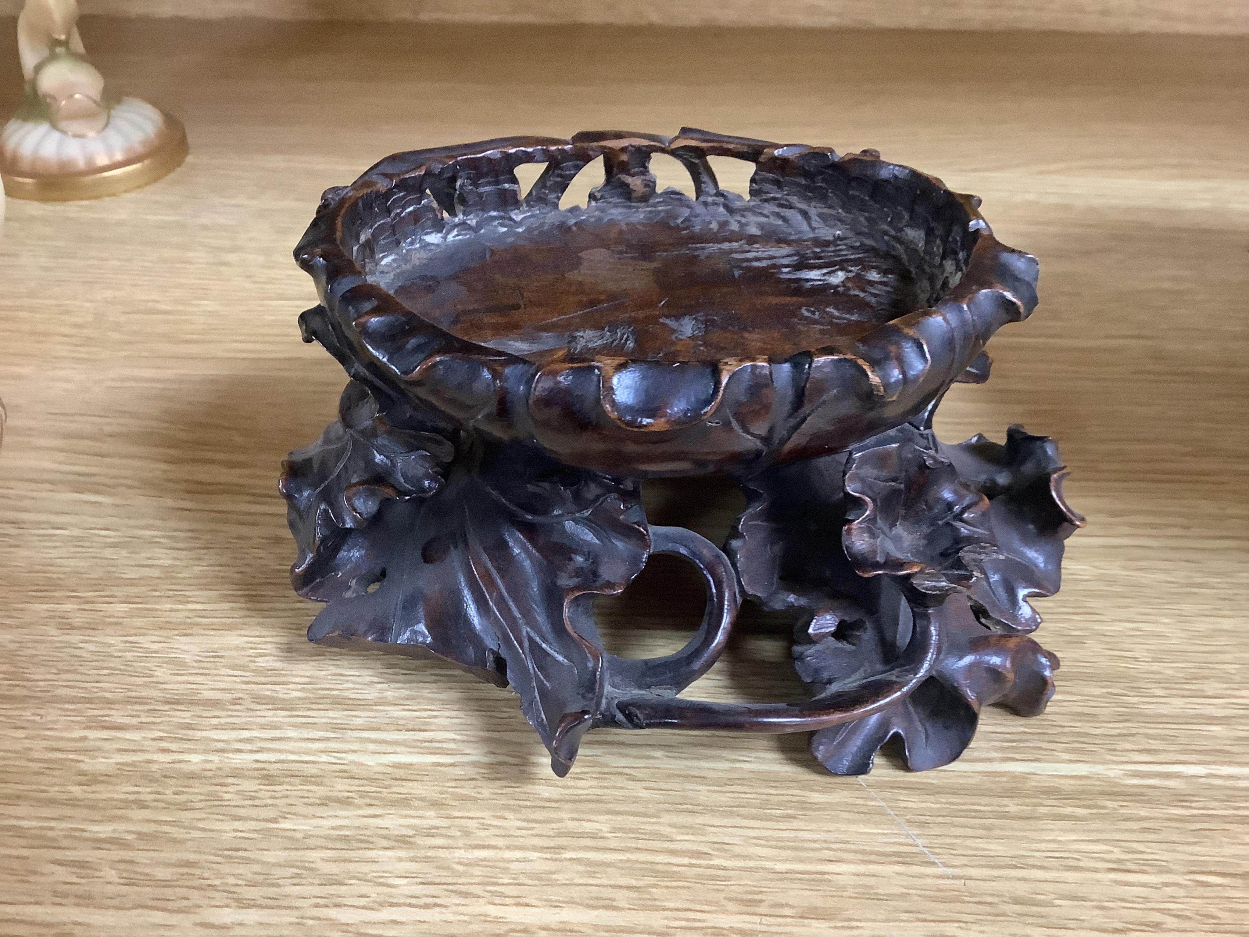 A Chinese hardwood vase stand, 8cm high. Condition - fair to good, some losses